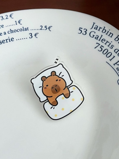 Значок «Capibra in Bed»