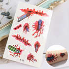 Переводная татуировка «Разорванная кожа с инструментами»