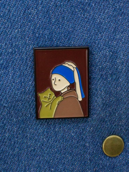 Значок «Girl with the orange cat»